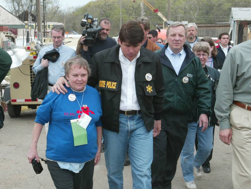 Mary Pawlak walks with former Illinois Gov. Rod Blagovich and U.S. Sen. Dick Durbin, D-Illinois downtown Utica to observe the damage from the tornado in 2004.