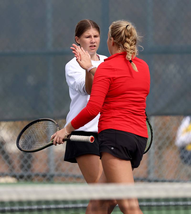 Benet AcademyÕs Shane Delaney & Clare Lopatka celebrate a point during the 1A Doubles Final match at the IHSA State Tennis Finals Saturday October 21, 2023 in Buffalo Grove.