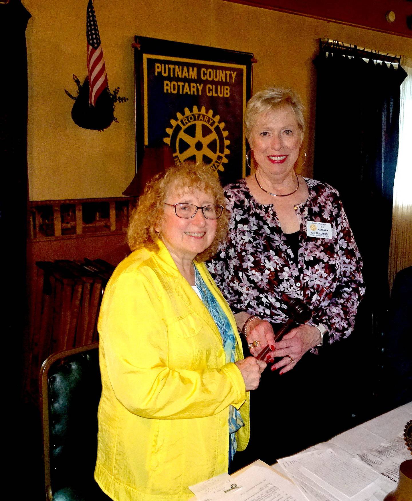 At Putnam County Rotary’s annual banquet held June 20 at Rolando's in Hennepin, Adriane Shore (on left) hands the Rotary president’s gavel to Cheri Adrian who takes the reins as of July 1.