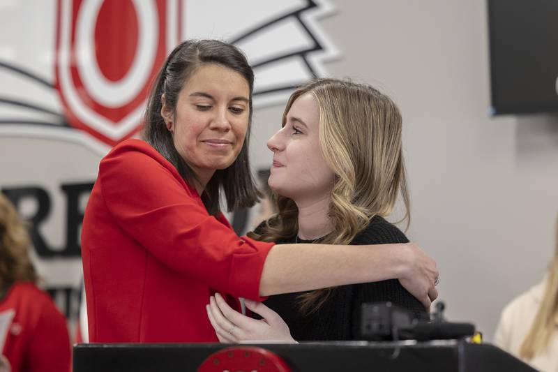 Kimberly Radostits embraces student Alyssa Leary Wednesday, Jan. 25, 2023 during a press conference announcing Radostits’ nomination for National Teacher of the Year.