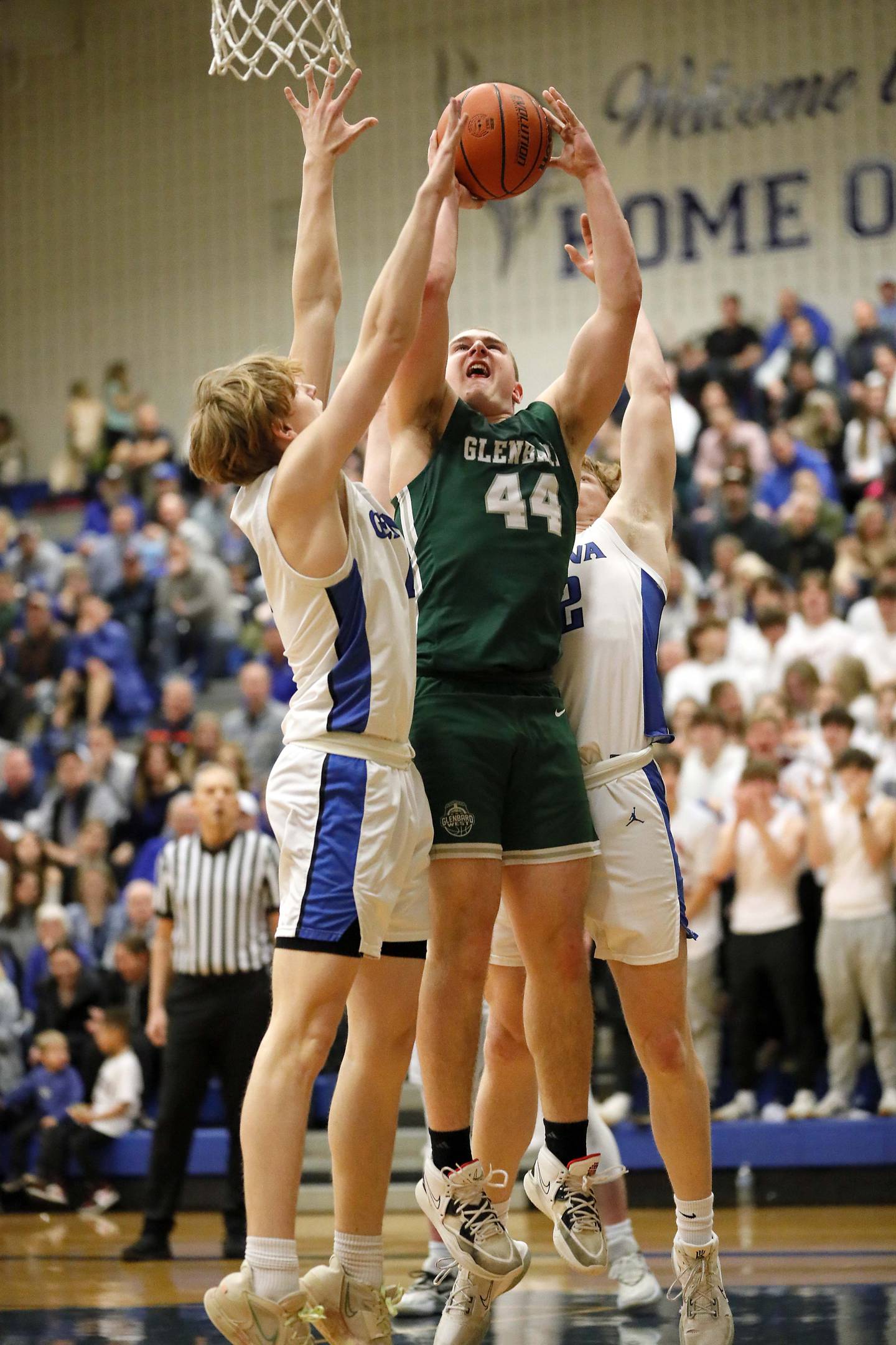 Glenbard West's Jack Oberhofer (44) puts up a shot in the lane against against the against the Geneva during the IHSA Class 4A Geneva regional championship game Friday February 24, 2023 in Geneva.