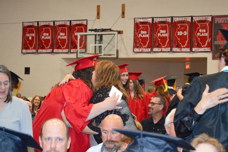 Chloe Reubin hugs her mother during the Forreston High School Class of 2023's commencement on May 14, 2023, which also was Mother's Day. Reubin plans to study graphic design and photography at Highland Community College.