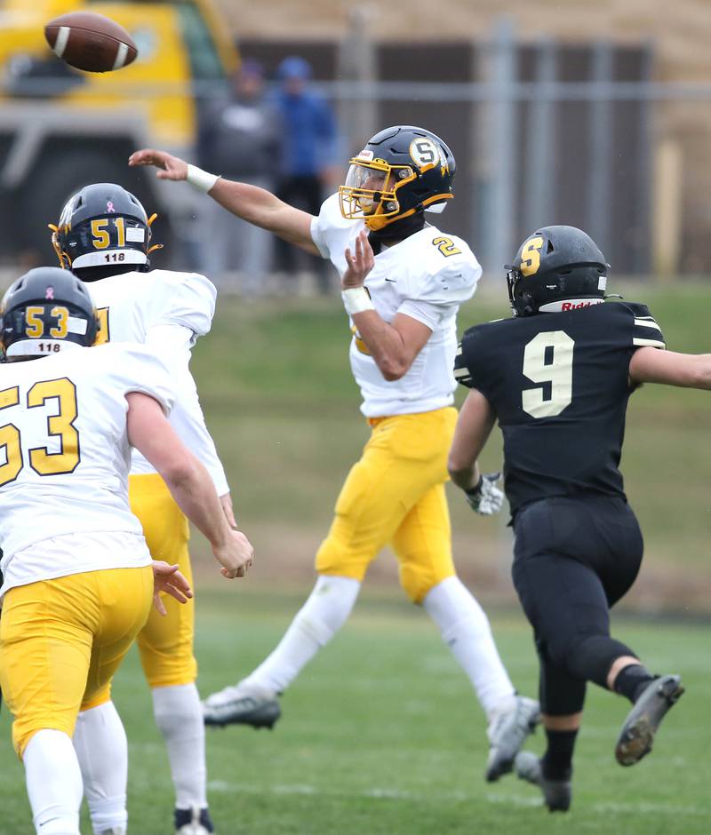 Sterling's JP Schilling throws a pass just ahead of the pressure of Sycamore's Dawson Alexander during their Class 5A state playoff game Saturday, Nov. 12, 2022, at Sycamore High School.
