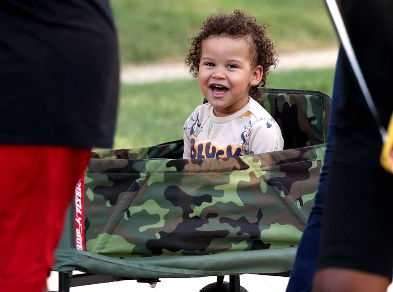 Legend Chappel, 2, from DeKalb, even joins the chants Friday, July 18, 2025, during the DeKalb Peace Walk and Rally. The event, which featured a march, food vendors and music, was held to encourage the community to work together against gun violence.