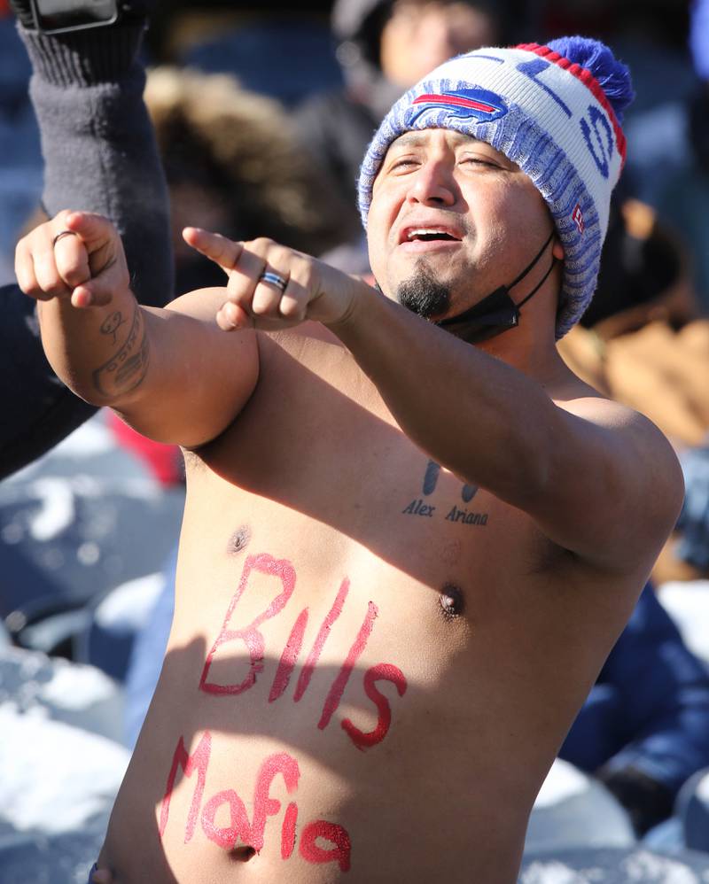 A Buffalo Bills fan doesn’t mind the cold Sunday, Dec. 24, 2022, at Soldier Field in Chicago.