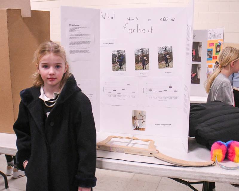Lucy Ray stands next to her art project on Saturday Jan. 25, 2025, during the Downers Grove District 58 science project held at O’Neill Middle school.