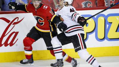 Blackhawks rally for point vs. Flames, lose in OT