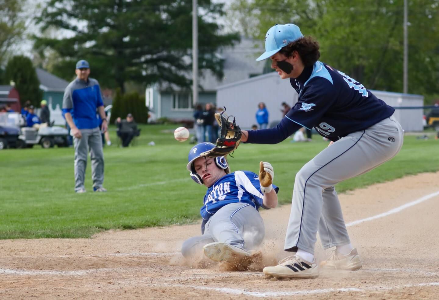 Princeton's Tyler Forristall beat the throw to Bureau Valley pitcher Logan Philhower covering home on a wild pitch in the third inning of Monday's game at Prather Field. The Storm rallied for a 9-7 win with six runs in the seventh inning.