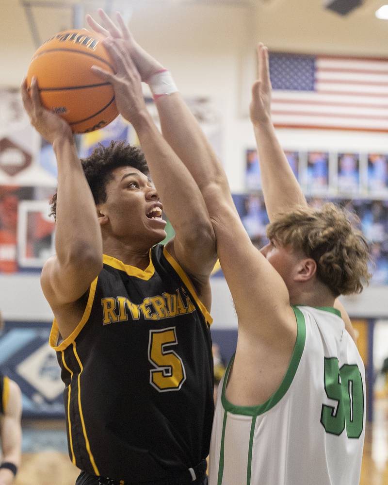 Riverdale’s Aris Morgan puts up a shot against Rock Falls’ Cole Mulnix Friday, Feb. 28, 2025, during the Class 2A Regional final at Bureau Valley High School.