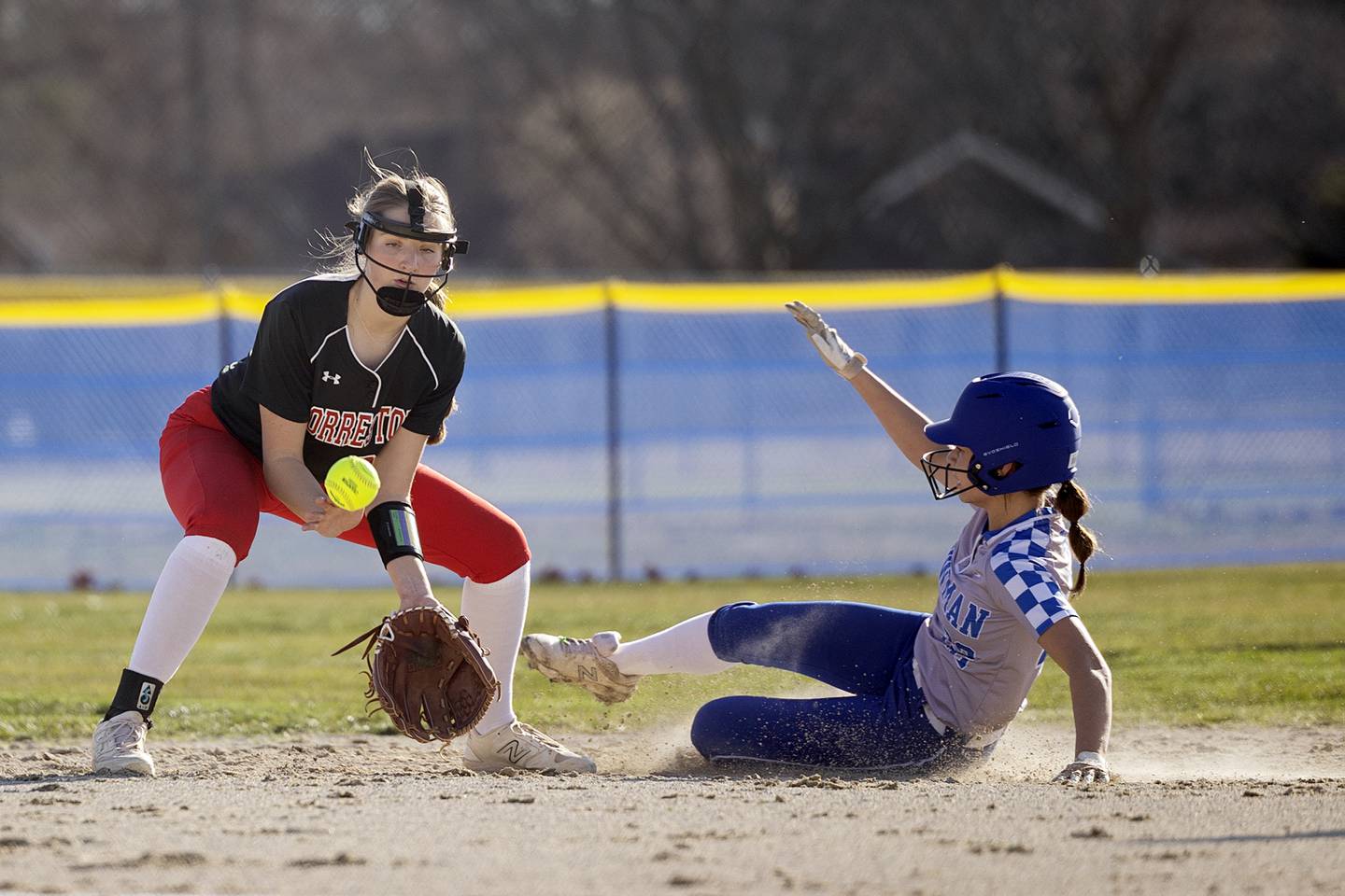 Forreston’s Jenna Greenfield fields a throw at second base as Newman’s Madison Duhon steals second Monday, March 11, 2024.