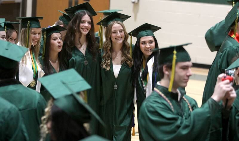 Members of the Class of 2025 pose for group pictures as they line up for graduation at Crystal Lake South High School in Crystal lake on Saturday, May 17, 2025.