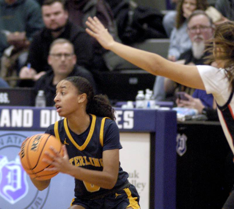 Sterling's Alivia Gibson  deals with Byron's defense  . The Sterling Golden Warriors played  the Byron Tigers in the championship game of the Dixon Holiday Tournament at Dixon High School on Monday, December 29th, 2025.