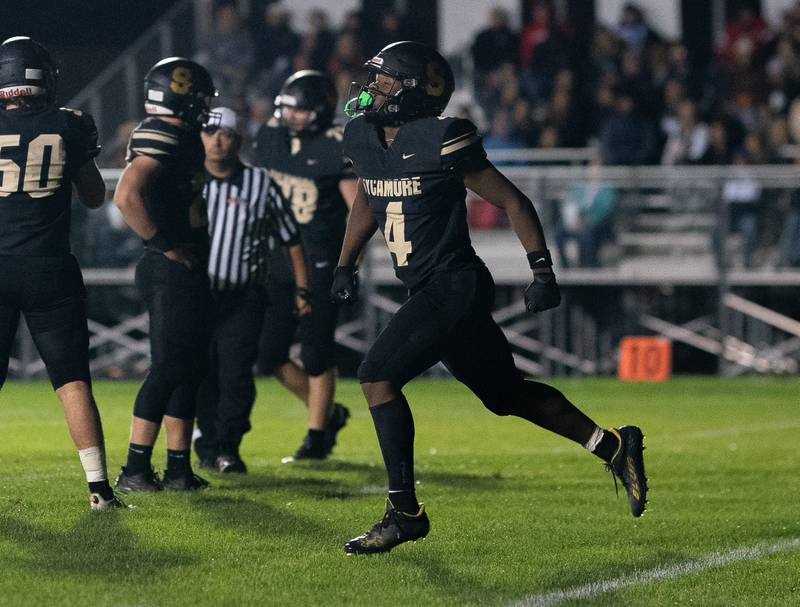 Sycamore's Tyler Curtis (4) runs back to the sideline after scoring his second touchdown against Kaneland during a football game at Kaneland High School in Maple Park on Friday, Sep 30, 2022.