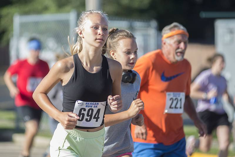 Runners in the 2022 Regan Run head north on Hennepin Avenue near the start of the 5K. The race returned to it’s original course on Saturday, July 2, 2022 after taking a cover hiatus in 2020 and a different route due to construction in 2021.