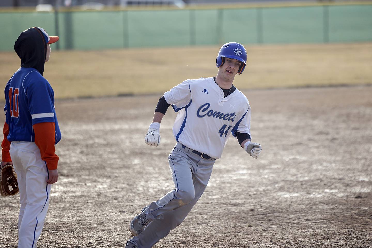Newman’s Kyle Wolfe rounds third to score against Eastland Tuesday, March 21, 2023.