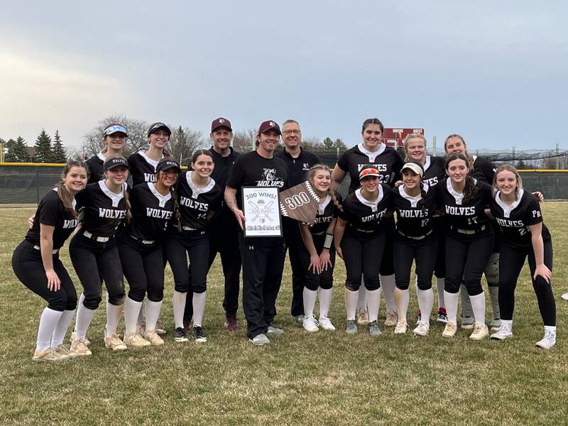 Prairie Ridge coach Scott Busam celebrates his 300th career win after the Wolves beat Larkin 6-3 in their season opener on Tuesday, March 12, 2024 at Prairie Ridge High School in Crystal Lake.
