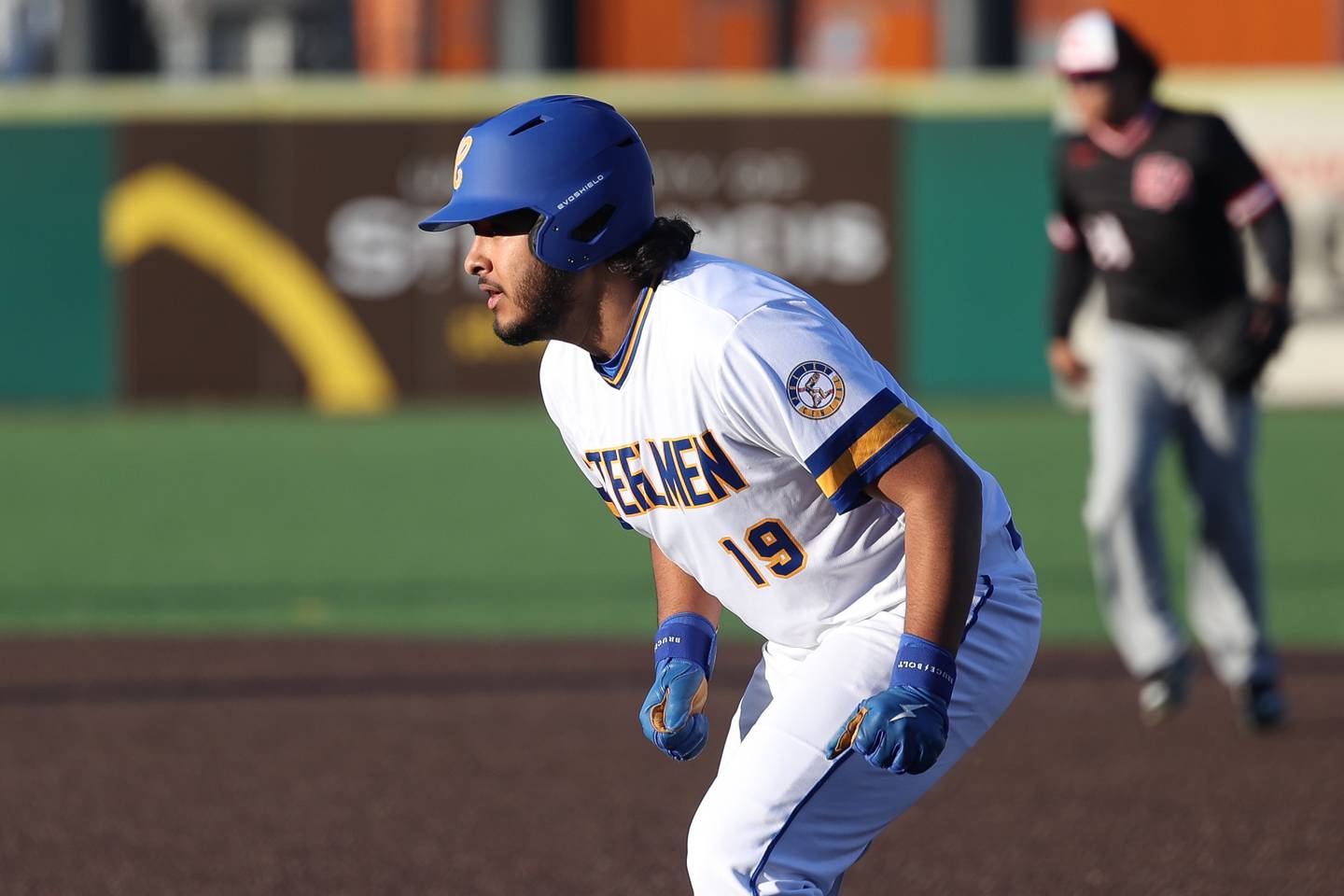 Joliet Central’s Jose Huizar-Ledezma leads off from first base against Aurora East on Monday, Mar. 11th in Joliet.
