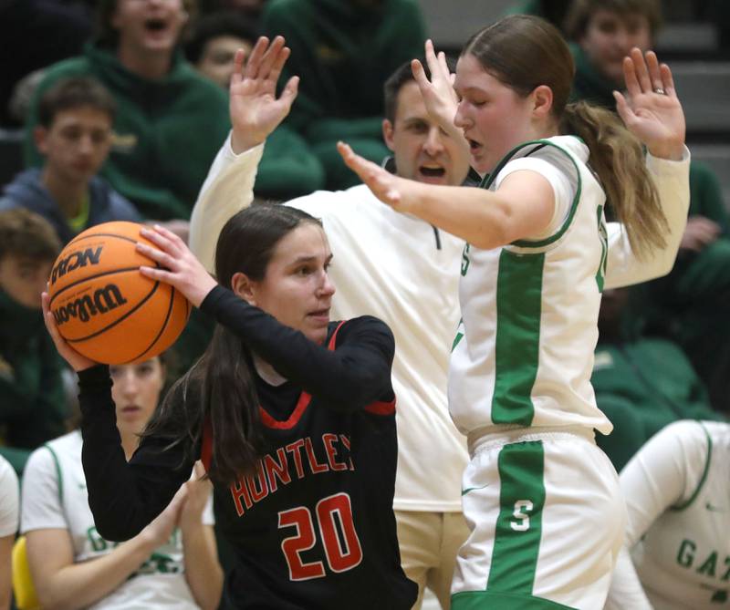 Huntley's Alyssa Borzych looks to pass as she is guarded buy Crystal Lake South's Ellie Starnes during a Fox Valley Conference girls basketball game on Friday, Jan. 30, 2026, at Crystal Lake South High School.