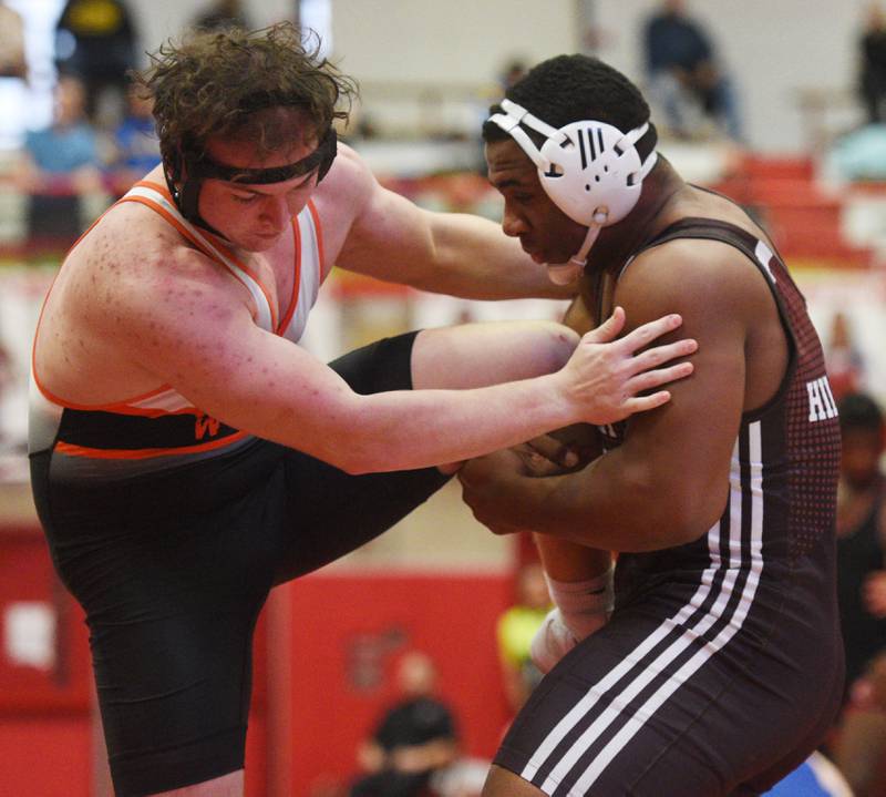 Joliet Catholic’s Dillan Johnson, right, wrestles Lincoln-Way West’s Nick Kavooras in a 285-pound semifinal bout during the Hinsdale Central wrestling tournament on Saturday December 16, 2023 in Hinsdale. (Joe Lewnard/jlewnard@dailyherald.com)