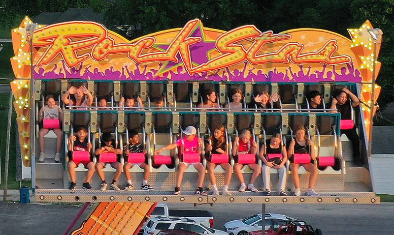 Kids spin on the Rockstar carnival ride during Spring Valley Summerfest on Thursday, June 19, 2025 downtown Spring Valley. The festival features a carnival, live entertainment, food vendors and fireworks on Saturday at dusk.