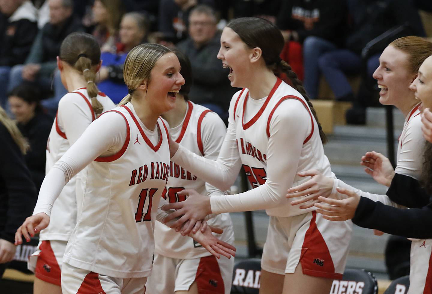 Huntley's Anna Campanelli receives high fives as she leaves the game in the final minute of Huntley’s win over Libertyville in the IHSA Class 4A Huntley Sectional Championship girls basketball game on Thursday, Feb. 27, 2025, at Huntley High School.