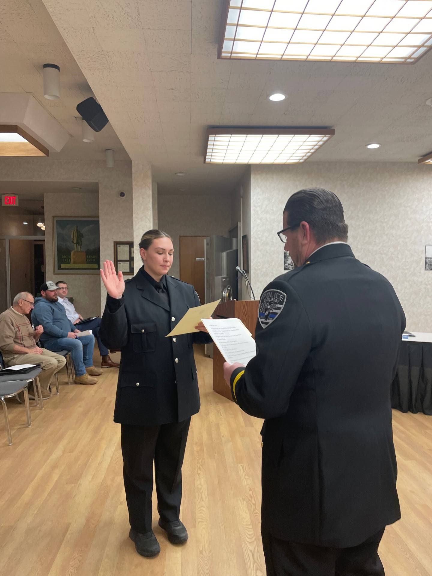 Oglesby Police Chief Mike Margis (right) administers the oath of office to Sgt. Randy Oscepinski. The city council voted unanimously Monday, Jan. 6, 2025, to make Oscepinski the city's first female sergeant.