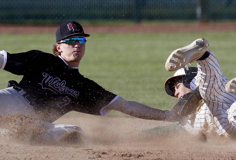Prairie Ridge's Gabe Winkelman tags out Crystal Lake South's Anthony Amici as he tries to steal second base during a Fox Valley Conference baseball game on Friday, May 15, 2026, at Crystal Lake South High School.