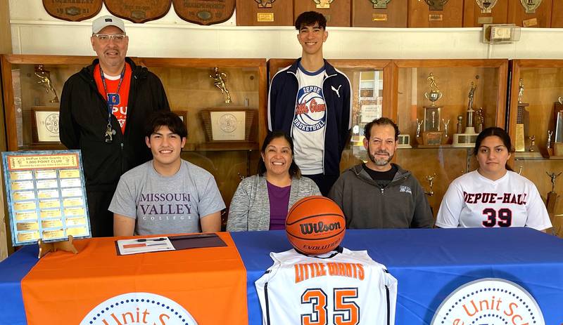 DePue's Andres Moreno (seated, left) will continue his basketball career at Missouri Valley College. He was joined by (seated left to right) his mom, Elvia Moreno, his dad, Martin Moreno, his sister, Jazmin Moreno and, standing left to right, DePue coach Charlie Klinefelter and assistant Cortland Klinefelter. Moreno averaged 20.6 points and 10.1 rebounds per game as a senior and eclipsed 1,000 career points.