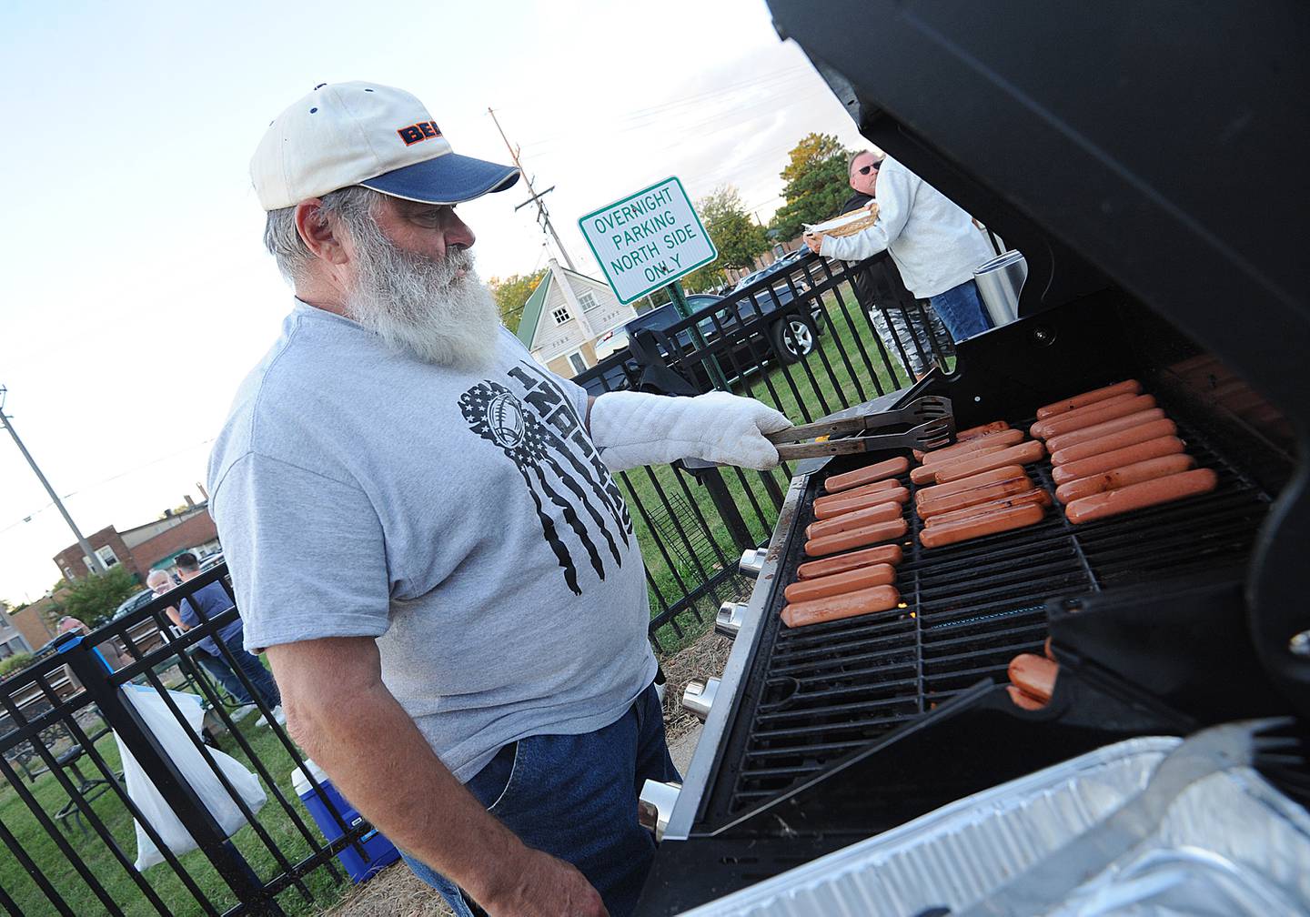Sandwich 3rd Ward Alderman Bill Fritsch mans the hot dog grill for the city of Sandwich during the Taste of Sandwich, Wednesday, Sept. 25, 2024, on Main Street in downtown Sandwich.