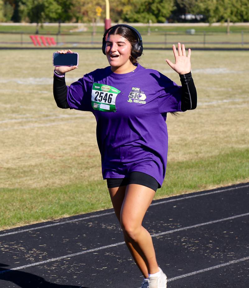 Angelina Campise gets ready to cross the finish line during the Sugar Grove Park District’s inaugural Run to Remember 5K & Fun Run on Saturday, Oct. 19, 2024 in Sugar Grove.
