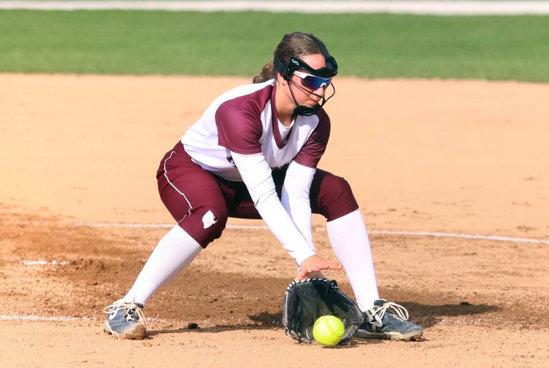 Marengo’s Jozsa Christiansen fields an infield chopper against Richmond-Burton in varsity softball on Tuesday, April 22, 2025, at Marengo High School in Marengo.
