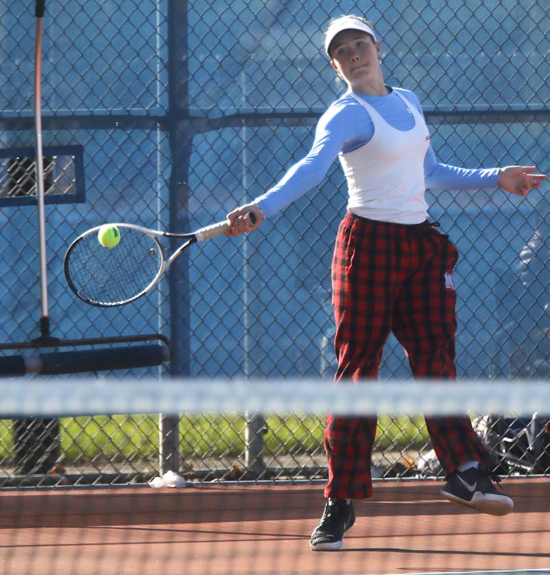 Marian Central’s Julia Lukey returns the ball Thursday, Oct. 23, 2025, during the first day of the IHSA State Girls Tennis Tournament at Schaumburg High School.