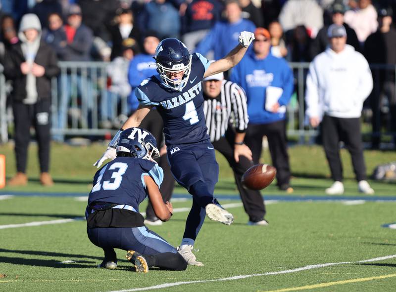 Nazareth's Drew Fowler (4) kicks a field goal against St. Francis during the boys varsity IHSA 5A semifinal between Nazareth Academy and St. Francis high school in La Grange Park, IL on Saturday, Nov. 18, 2023.