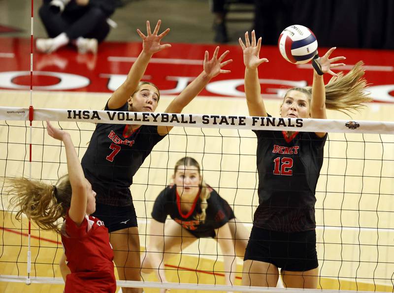 Benet Academy's Audrey Asleson (7) and Lynney Tarnow (12) with a block during the IHSA Class 4A girls volleyball championship match Saturday, Nov. 16, 2024 at CEFCU Arena in Normal.
