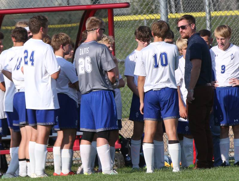 Princeton boys soccer head coach David Gray huddles with the team before the game against Ottawa on Tuesday, Oct. 3, 2023 at Ottawa High School.