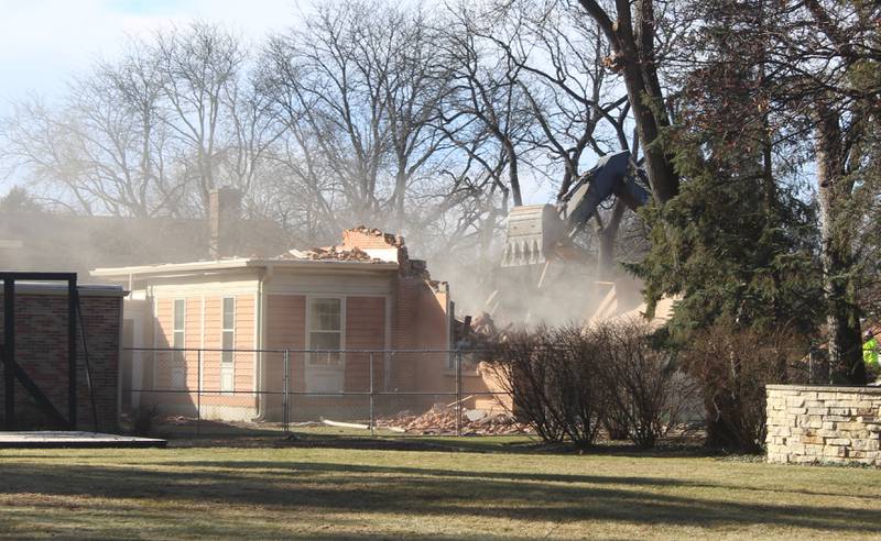 Final parts of the Academy Building in Crystal Lake, built in the 1850s, gets demolished on Jan. 13, 2026.