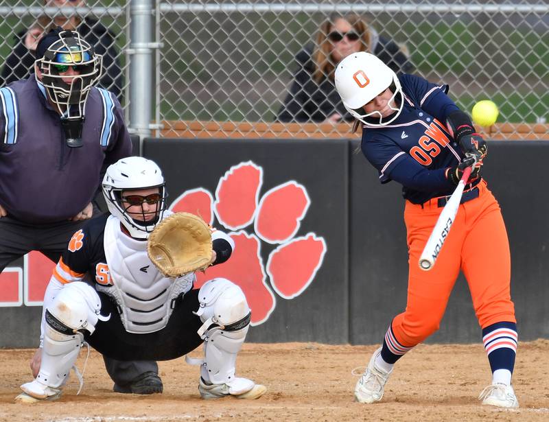 Oswego’s Leah McKenzie connects for a towering home run during a game against Wheaton Warrenville South on April 10, 2025 at Wheaton Warrenville South High School in Wheaton.
