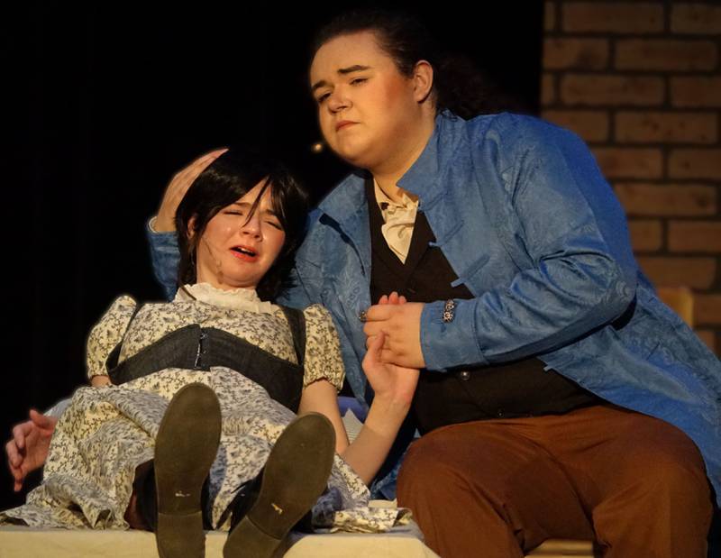 Emily Kmetz (Fantine) and Adrian Silva (Jean Valjean) act out a scene in the musical "Les Miserabels" on Tuesday, March 13, 2024 in Matthiessen Memorial Auditorium at La Salle-Peru Township High School.