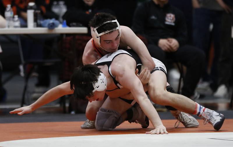 Crystal Lake Central’s Jackson Marlett tries to control Fenwick’ CJ  Brown as they compete in the 113-pound third place match of the IHSA 2A Crystal Lake Central Wrestling Sectional on Saturday, Feb. 15, 2025, at Crystal Lake Central High School.