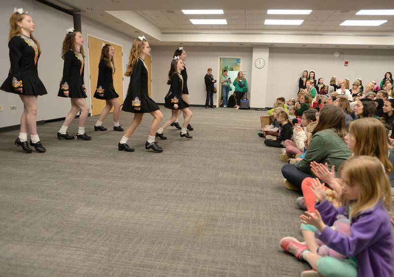 Trinity Irish Dancers entertain the crowd at the Downers Grove Library Saturday, March 16, 2024.