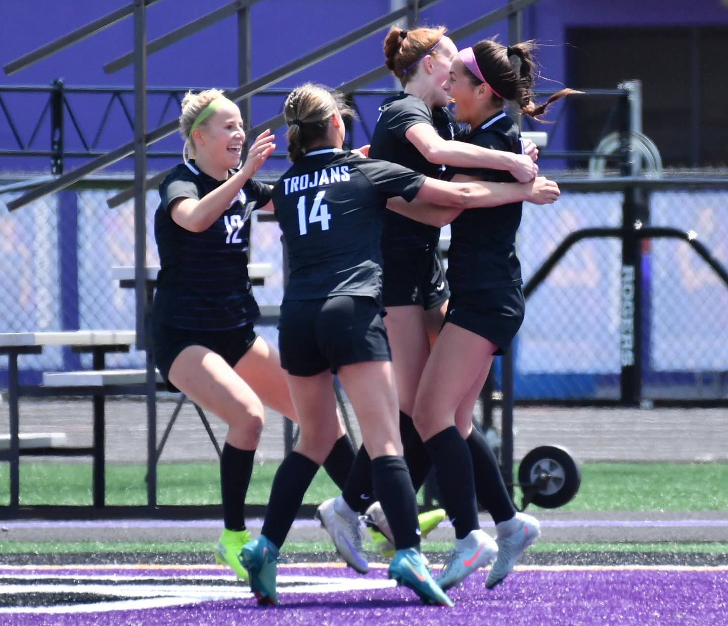 Downers Grove North’s Campbell Thulin (right) celebrates with teammates after scoring a goal during a game against Downers Grove South on May 10, 2025 at Downers Grove North High School in Downers Grove .