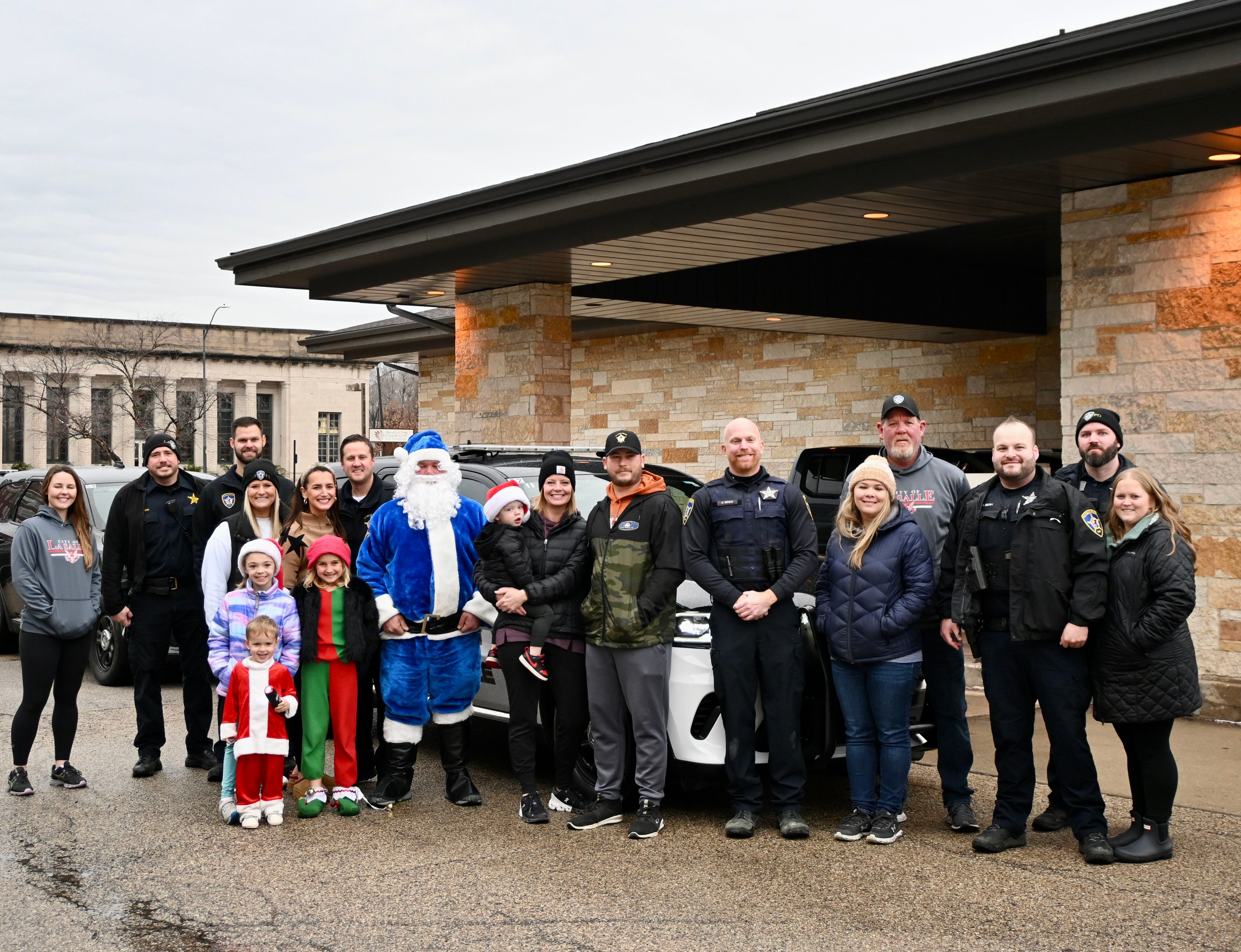 Friends, families and officers came out Saturday to deliver gifts as a part of La Salle's Officer Santa Program on Dec. 16.