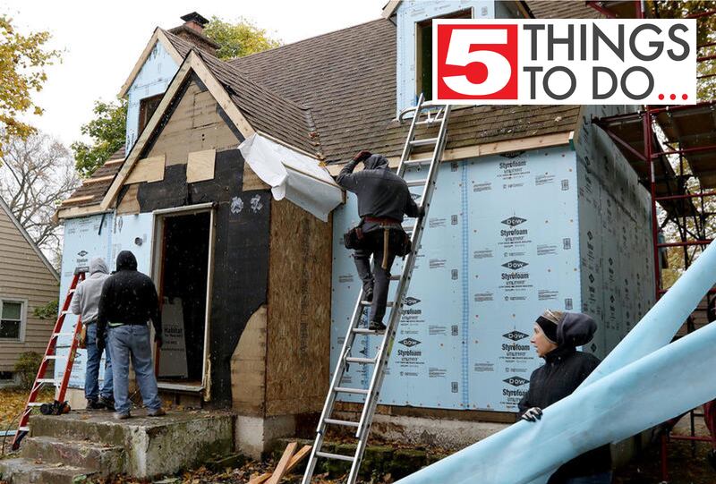 Volunteers with Habitat for Humanity work Wednesday, Oct. 30, 2019, on restoring a home at 209 W. Greenwood Ave. in Woodstock.