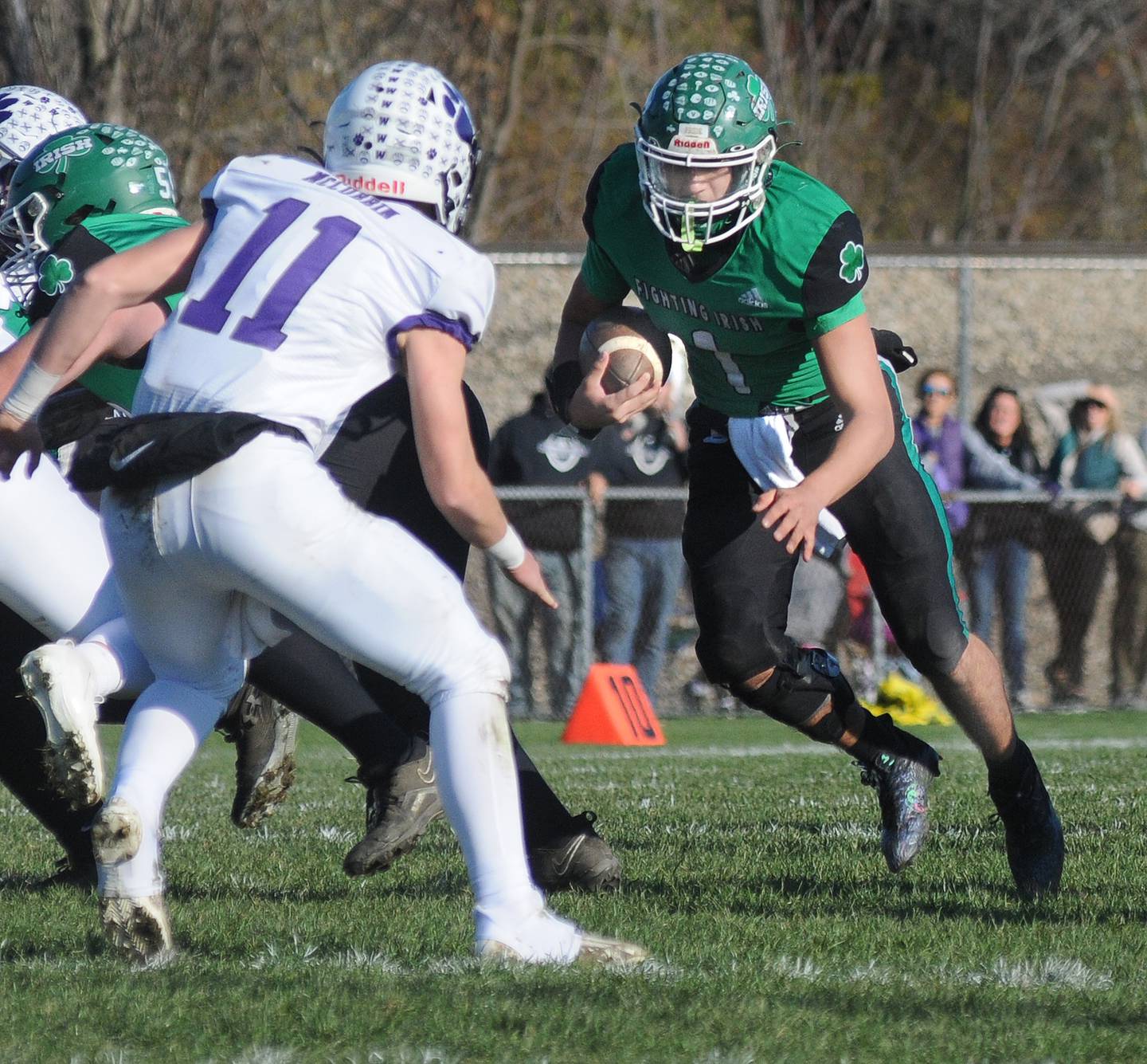 Seneca’s Nathan Grant looks to get past Wilmington’s Cade McCubbin on a run in the 1st quarter Saturday during the Class 2A Quarterfinal at Seneca.