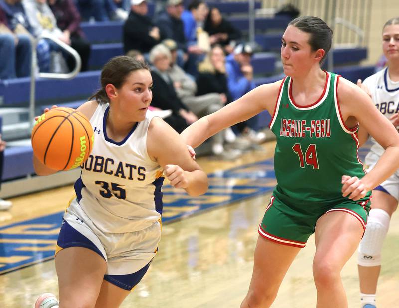 Somonauk-Leland's Kennedy Barshinger drives by La Salle-Peru's Drew Depenbrock during their game Thursday, Nov. 20, 2025, in the Tim Humes Breakout girls basketball tournament at Somonauk High School.