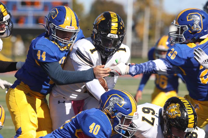 Joliet West’s Carl Bew scores on the quarterback keeper against Joliet Central on Saturday.