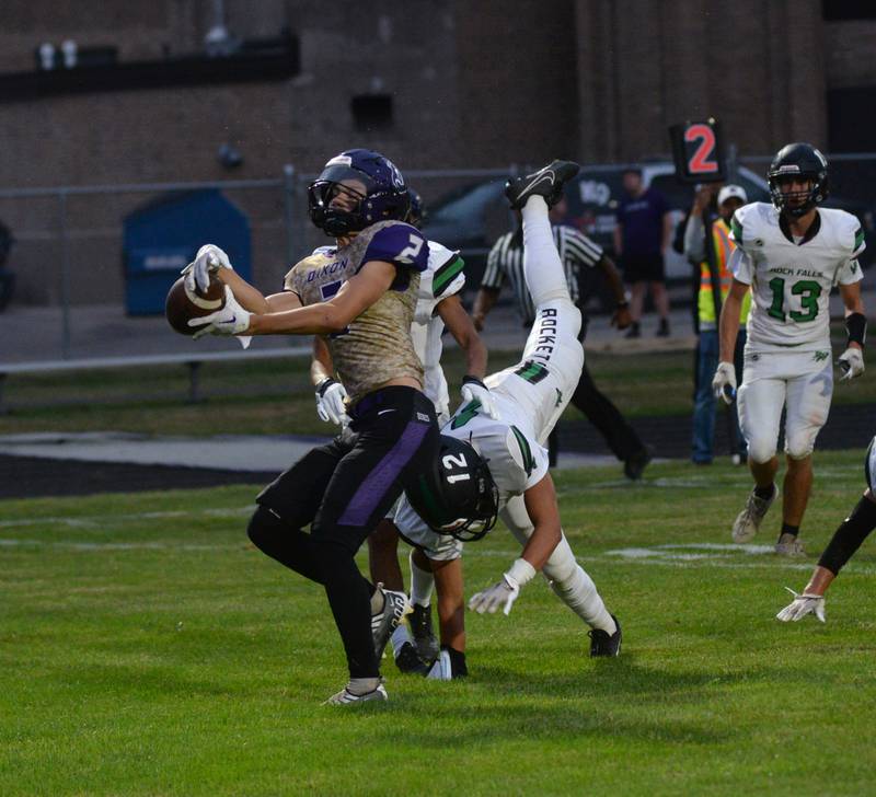 Dixon's Cullen Shaber (2( catches a pass for a TD as Rock Falls' Austin Castenada (12) defends at the AC Bowers Field at Dixon High School on Friday, Sept. 9, 2023.