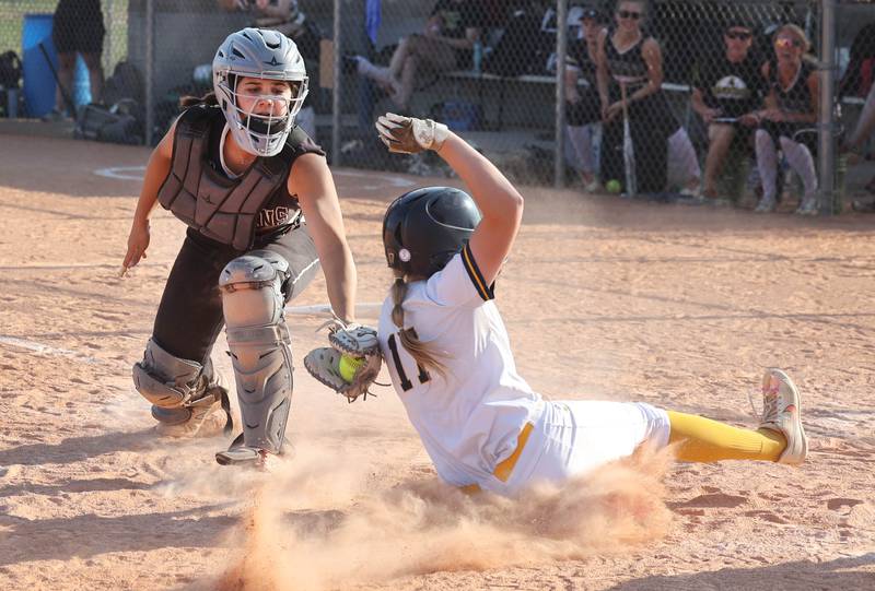 Sycamore's Kairi Lantz tags out Sterling's Lauren Jacobs as she tries to score during their Class 3A sectional championship game Friday, June 2, 2023, at Belvidere North High School.