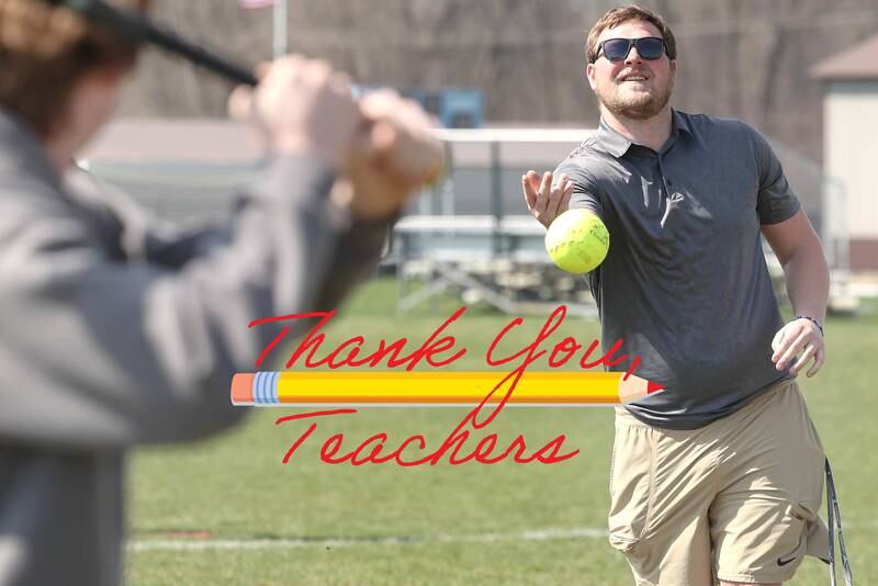 Griffin McNeal, Genoa-Kingston High School physical education teacher, pitches to students in his class Thursday, April 13, 2023, as they get outside to play some softball.