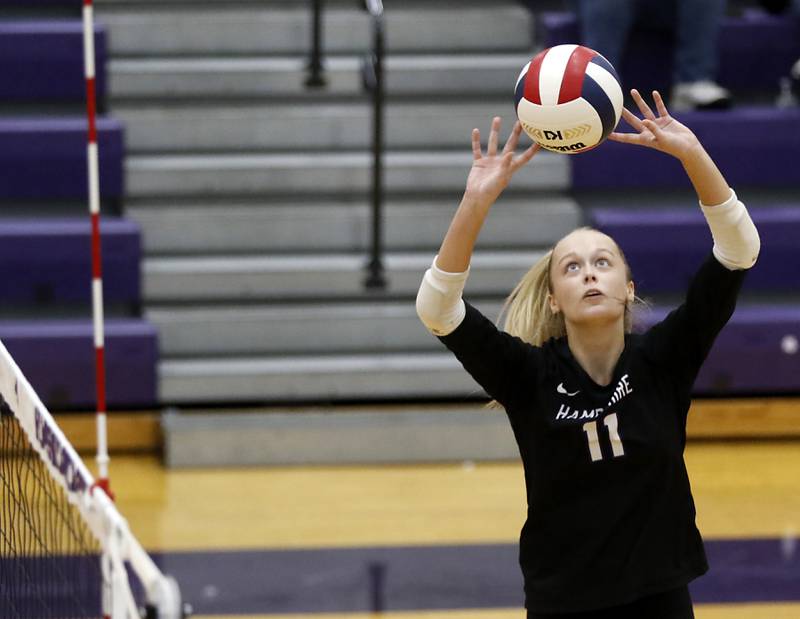 Hampshire's Jorah Rutter sets the ball during a Fox Valley Conference volleyball match against Crystal Lake Central on Tuesday, Sept. 24, 2024, at Hampshire High School.